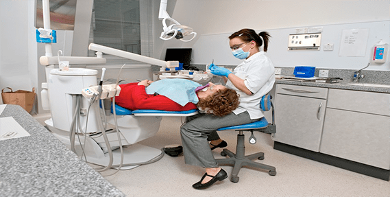 Dentist treating a patient at Two Rocks Dental Care
